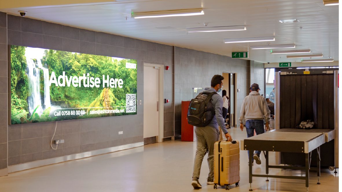 A back-lit board in the airport terminal